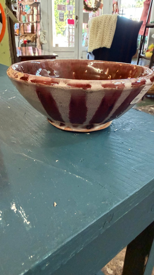 Burgundy and cream drip-glaze pottery bowl