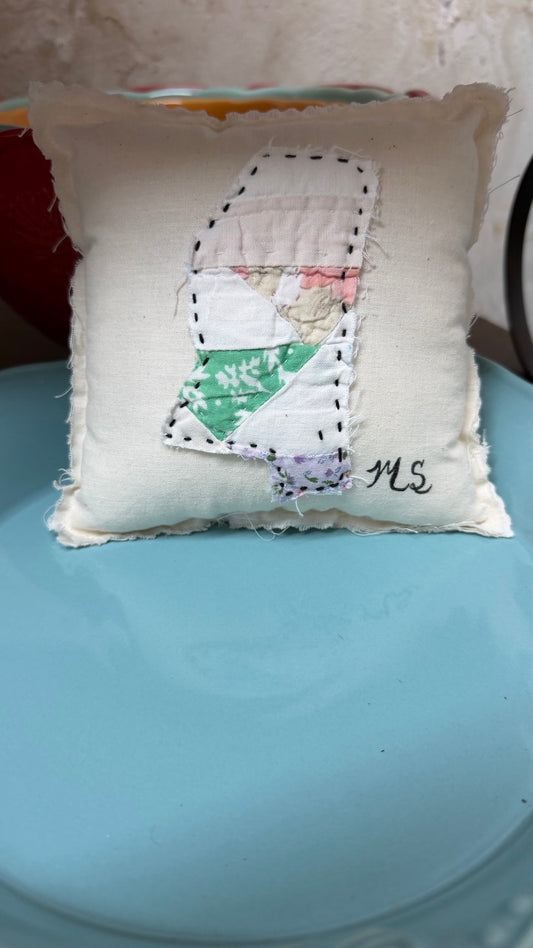 Handmade accent pillow with quilt basket patch