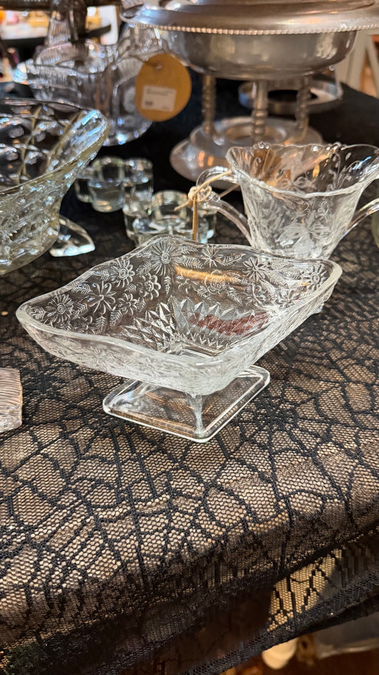 Vintage clear pressed glass square pedestal dish with floral pattern