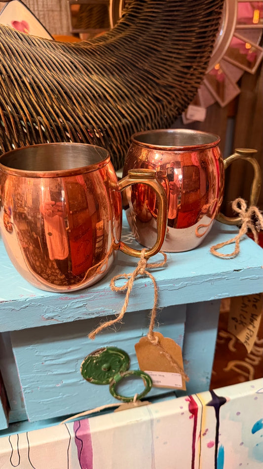 Pair of copper-tone mugs with brass-tone handles