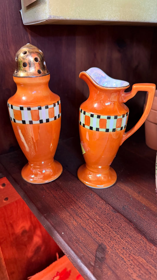 Orange checkered lusterware caster and creamer pair