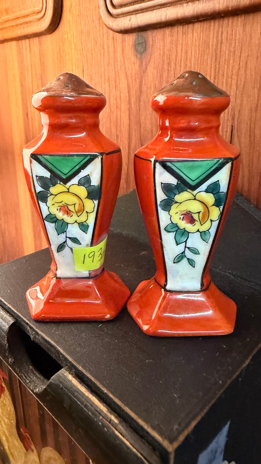 Pair of orange floral ceramic salt and pepper shakers